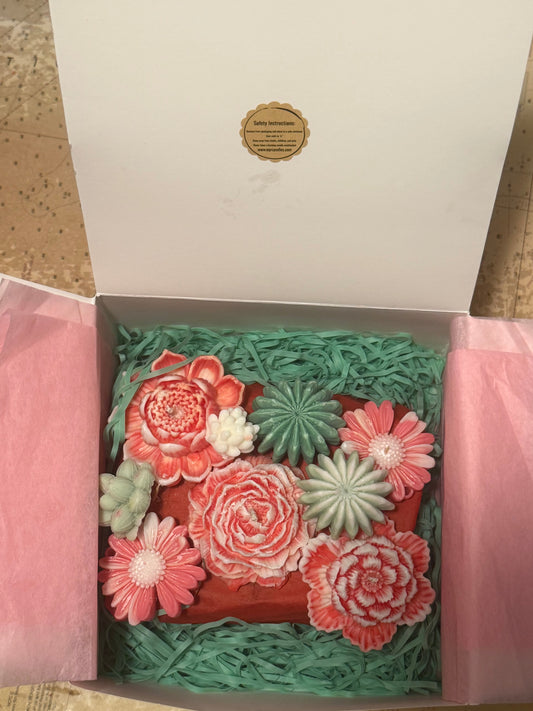 Decorative box with flower candles and wax melts. 